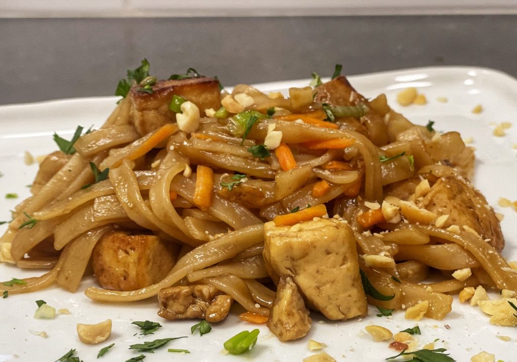 This vegan pad thai recipe with gluten free noodles is fast, and the flavors are right on! From the For Animals. For Earth. vegetarian and gluten free recipe blog.